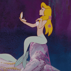 gif of a blonde mermaid from peter pan checking her hair